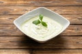 Vegetarian spinach cream soup with yogurt and mint leaves Royalty Free Stock Photo