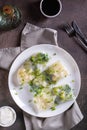 Vegetarian spring rolls with three types of cabbage in rice paper on a plate top and vertical view Royalty Free Stock Photo