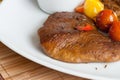 Vegetarian steak made from vegan meat seitan, with cherry tomatoes Royalty Free Stock Photo