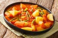 Vegetarian stew of carrots, green beans and potatoes in a spicy tomato sauce close-up in a bowl. horizontal Royalty Free Stock Photo