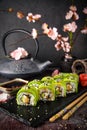 Vegetarian sushi rolls avocado with cream Philadelphia cheese, sesame, unagi sauce. Sushi menu. Royalty Free Stock Photo