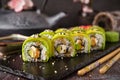 Vegetarian sushi rolls avocado with cream Philadelphia cheese, sesame, unagi sauce.