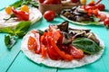 Vegetarian tacos with eggplant, cherry tomatoes, sweet peppers on a bright wooden background. Royalty Free Stock Photo