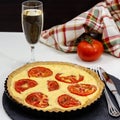 Vegetarian Tomato and ricotta tart and wineglass of white grape wine Royalty Free Stock Photo