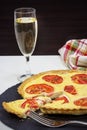 Vegetarian Tomato and ricotta tart and wineglass of white wine Royalty Free Stock Photo