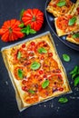 Vegetarian tomato tart or puffed pizza with herbs