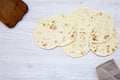 Vegetarian tortillas on white wooden table. Flat lay. Copy space.