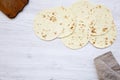 Vegetarian tortillas on white wooden table. Flat lay. Copy space