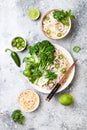 Vegetarian traditional Vietnamese soup Pho bo with herbs, rice noodles, broccolini, bok choy. Asian food concept.