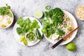 Vegetarian traditional Vietnamese soup Pho bo with herbs, rice noodles, broccolini, bok choy. Asian food concept.