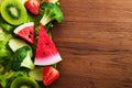 Vegetarian and vegan diet month in january called Veganuary. healthy raw vegetables and fruits on wooden background. Royalty Free Stock Photo