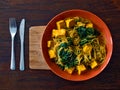 Vegetarian or vegan Indian food with noodles, spinach and tofu