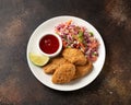 Vegetarian vegan southern fried nuggets served with sweet chilli sauce and cabbage salad