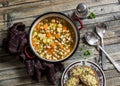 Vegetarian vegetable bean soup and parmesan cheese toasts on a wooden rustic table, top view. Royalty Free Stock Photo