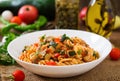 Vegetarian Vegetable pasta Fusilli with zucchini, mushrooms and capers in white bowl Royalty Free Stock Photo