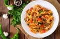 Vegetarian Vegetable pasta Fusilli with zucchini, mushrooms and capers in white bowl Royalty Free Stock Photo