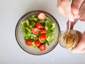 Vegetarian vegetable salad. Fresh salad flying to bowl in super slow motion. Avocado Tomato Salad Royalty Free Stock Photo