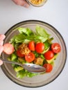 Vegetarian vegetable salad. Fresh salad flying to bowl in super slow motion. Avocado Tomato Salad Royalty Free Stock Photo