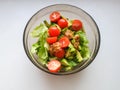 Vegetarian vegetable salad. Fresh salad flying to bowl in super slow motion. Avocado Tomato Salad Royalty Free Stock Photo