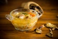 Vegetarian vegetable soup with porcini mushrooms in a glass bowl Royalty Free Stock Photo