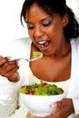 Vegetarian woman eating a attractive green salad Royalty Free Stock Photo