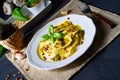 A Vegetariano italiano! Tortelli with roasted pine nuts and pesto basilico Royalty Free Stock Photo