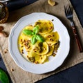 Vegetariano italiano! Tortelli with roasted pine nuts and pesto basilico Royalty Free Stock Photo