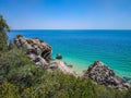 Vegetation and rocks with clear turquoise water from the Atlantic Ocean at Galapos beach, ArrÃÂ¡bida - SetÃÂºbal PORTUGAL