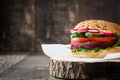 Veggie beet burger on a rustic wood