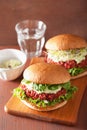 Veggie beet and quinoa burger with avocado dressing Royalty Free Stock Photo