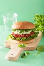 Veggie beet and quinoa burger with avocado dressing Royalty Free Stock Photo