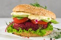 Veggie burger with beetroot and avocado on white marble table. Healthy vegan food Royalty Free Stock Photo