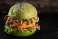 Veggie burger. lettuce, the cutlet vegetarian meat alternatives. dark background Royalty Free Stock Photo