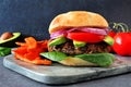 Veggie burger with sweet potato fries on a dark background Royalty Free Stock Photo