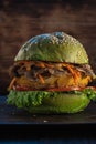 Veggie burger. wooden background. copyspace. Vertical orientation. close up Royalty Free Stock Photo