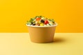 Veggie Delight Bowl tasty fast food street food for take away on yellow background