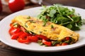 veggie omelette garnished with diced red pepper