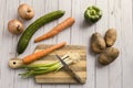 Veggies and a cutting board Royalty Free Stock Photo