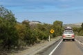 Vehicle with camping equipments on top driving on Cape du Couedic road on Kangaroo Island, South Australia Royalty Free Stock Photo