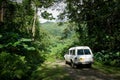 Vehicle on a dirt road through the jungle in Raiatea, Tahiti Royalty Free Stock Photo