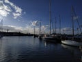 Vehicle dock boat marin sea harbor reflection watercraft bay mast port dusk water sailboat evening sail ship sky waterway coast Royalty Free Stock Photo