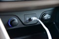 Connected USB cable into the USB port on the car dashboard Royalty Free Stock Photo