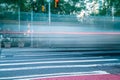 Vehicle light trails on the street of New York. Long exposure in early morning road traffic and pedestrian crossing Royalty Free Stock Photo