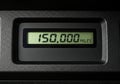 Vehicle odometer displaying 150,000 miles mark on a dashboard panel Royalty Free Stock Photo