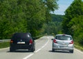 A vehicle overtakes near a dangerous curve.