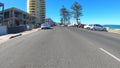 Vehicle POV, driving along The Esplanade in Glenelg, South Australia.