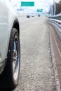 Vehicle side view standing on highway route, closeup Royalty Free Stock Photo