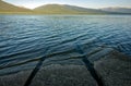 Vehicle tracks at the old boat launch lead into the lake the Quiet Lake Campground in Yukon Territory, Canada