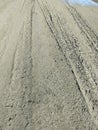 vehicle tracks on the rain ground Royalty Free Stock Photo