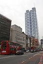 Central London street with its typical double-decker bus in London.